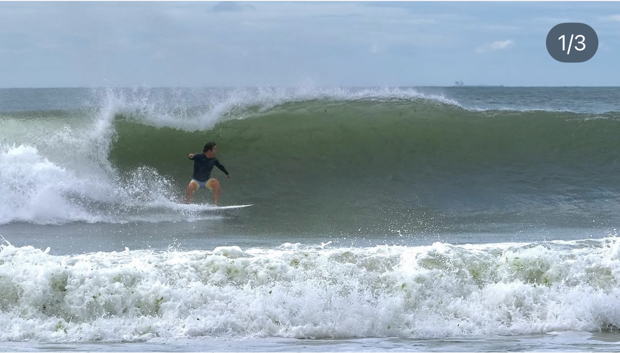 Benji surfing a wave
